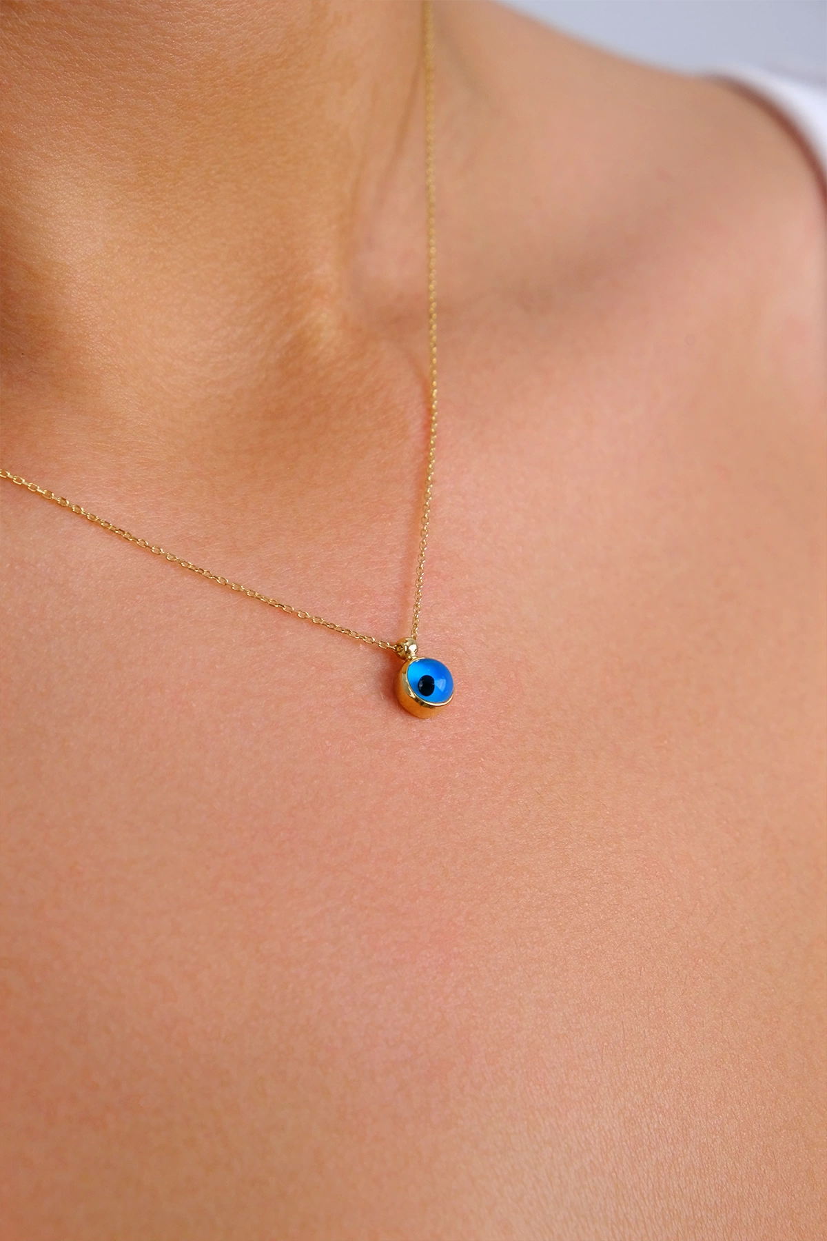 14-k-altin-kolye-171-gram-2649.png 14 Ayar Altın Minimal Nazar Boncuğu Kolye 125 - Görsel 1